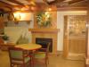 Lobby area with fireplace and bird aviary